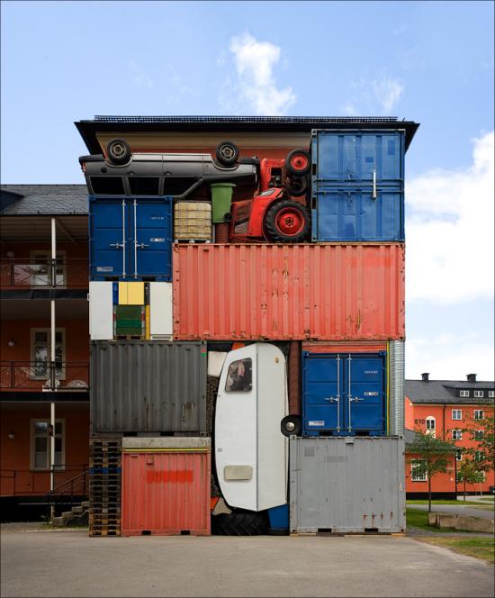 Self Contained, 2010 Containers, caravan, tractor, Volvo, pallets, refrigerators, etc. Dimensions: 8,2 x 10.8 x 2,4 m. Installation view: Umedalen Skulptur, Galleri Andersson/Sandstrom, Umea (SE)