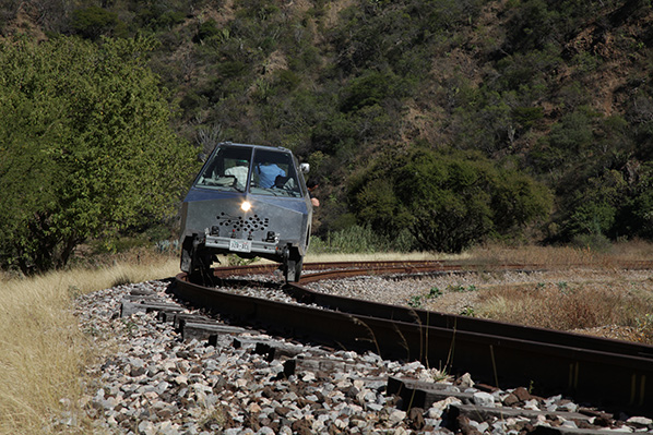SEFT vehicle on rails with artists on