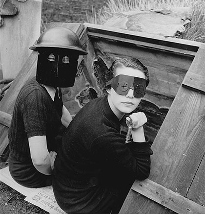 Lee Miller photographed women in fire masks in wartime London in 1944. [Source: Telegraph/Lee Miller Archives]