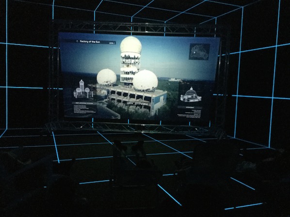 ﻿Hito Steyerl's Factory of the Sun. On the screen the old NSA listening post in former West-Berlin. The video is presented in a faux holodeck.