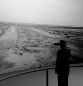 Petko Dourmana, an installation, darkened space with night vision headsets, bleak, featureless landscape 